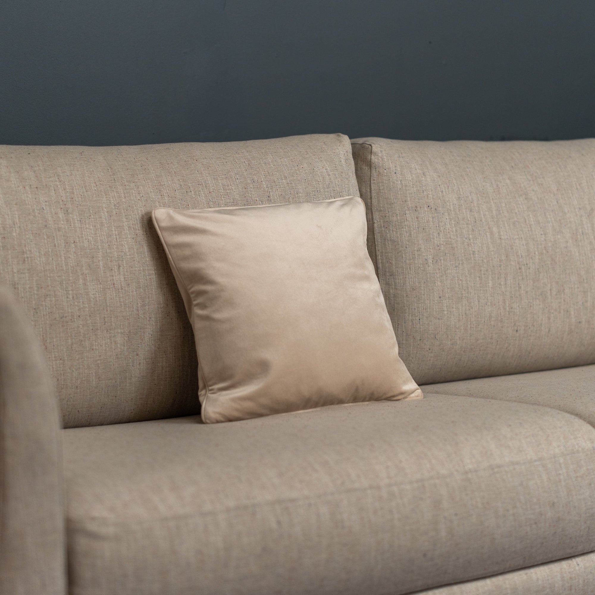 Mocha Cushion on a beige sofa