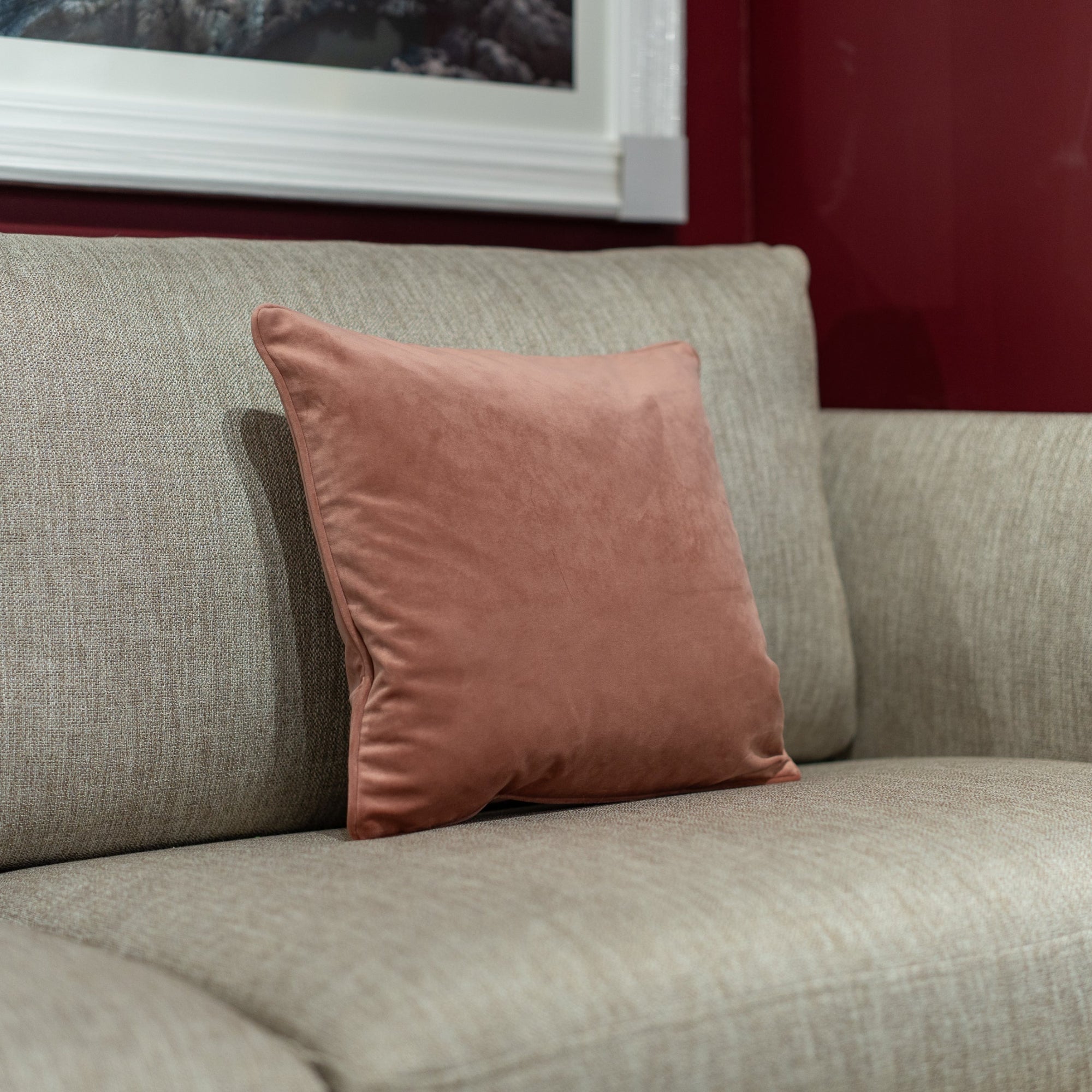 Rose cushion on a gray sofa