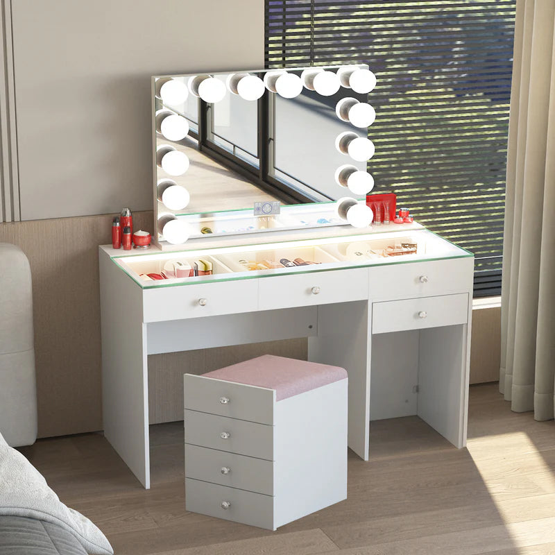 White vanity table with mirror and lights in a room setting