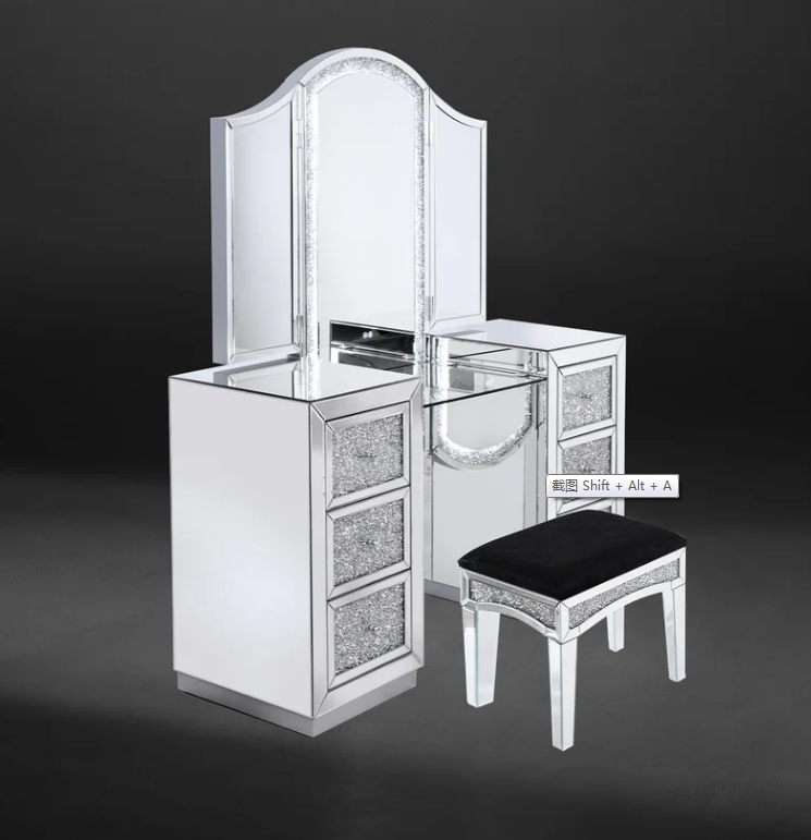 Silver mirrored vanity set with drawers and stool, black cushion.