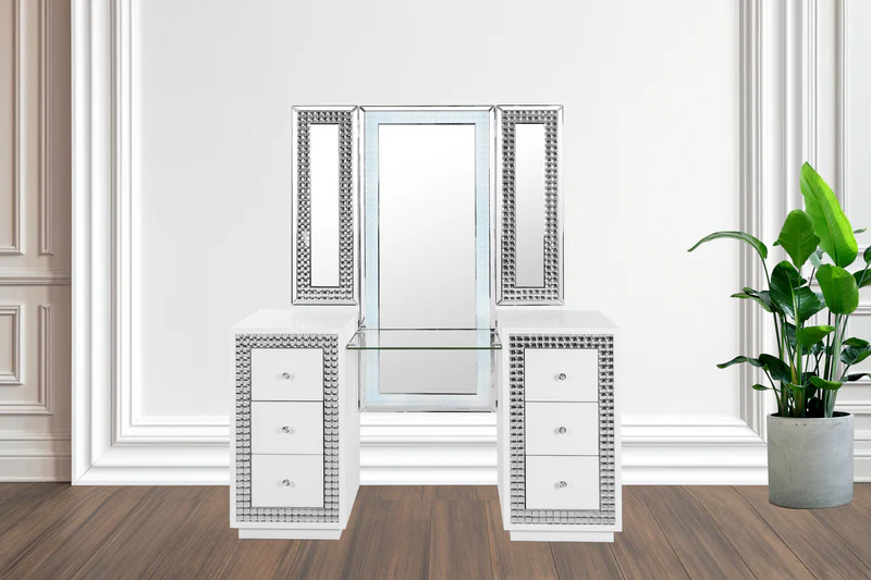 Elegant dressing table with mirrored drawers and a large potted plant beside it.