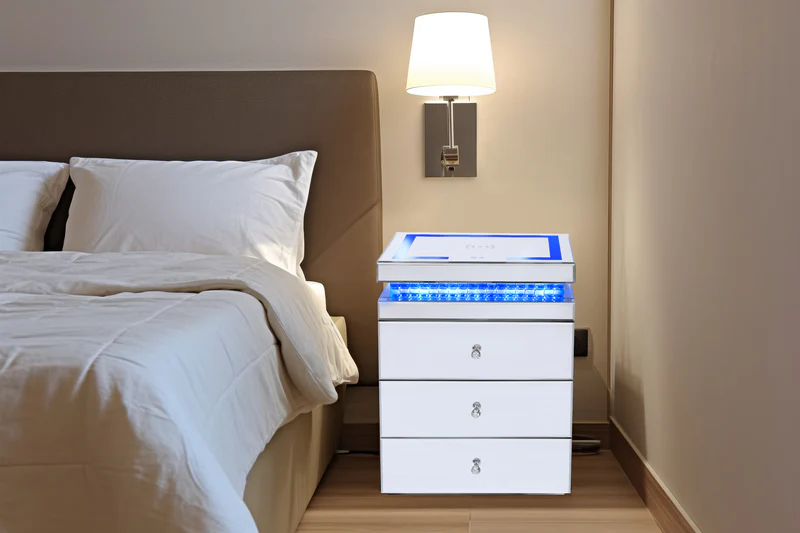 A sleek bedside drawer unit with blue LED lighting