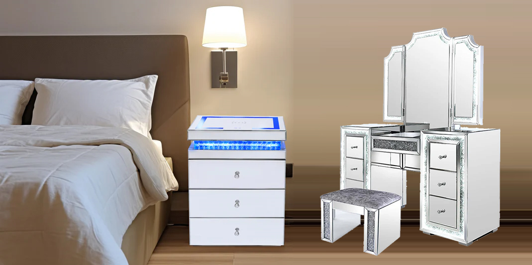 A sleek bedside drawer unit with blue LED lighting, and a mirrored vanity table with a stool