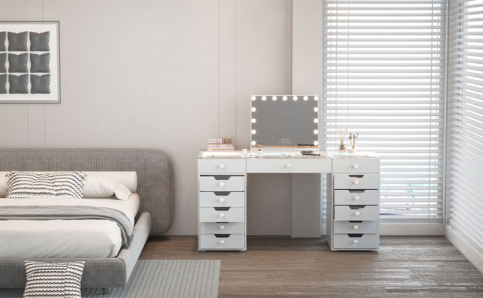 A modern bedroom with a white vanity table featuring lighted mirrors