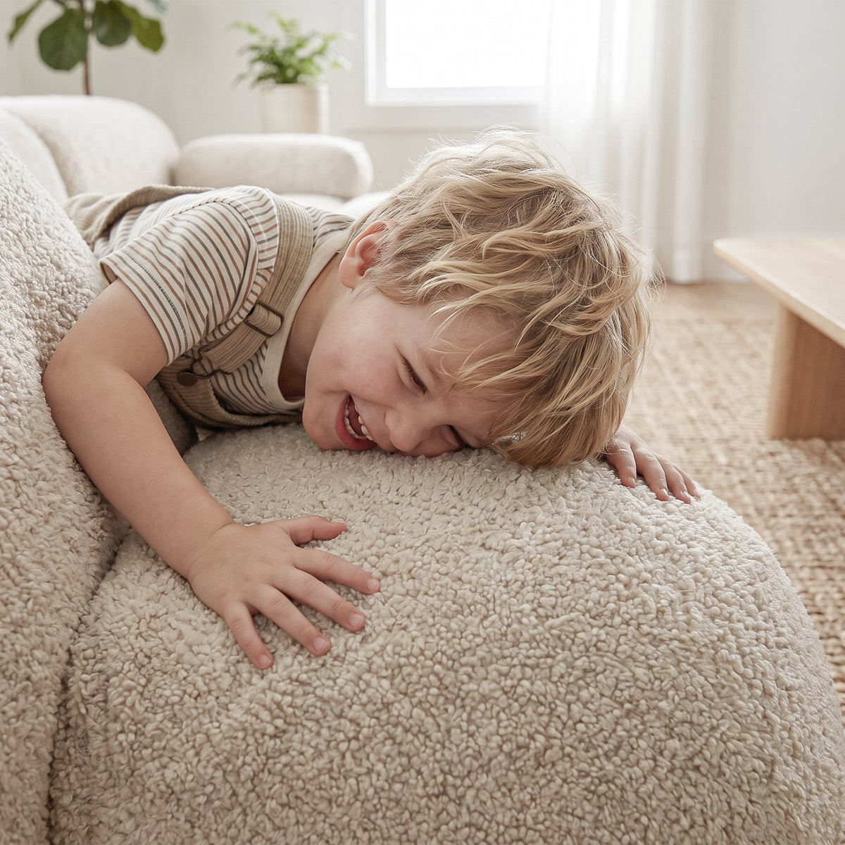 The little boy happily held the oversized plush dog-shaped sofa.