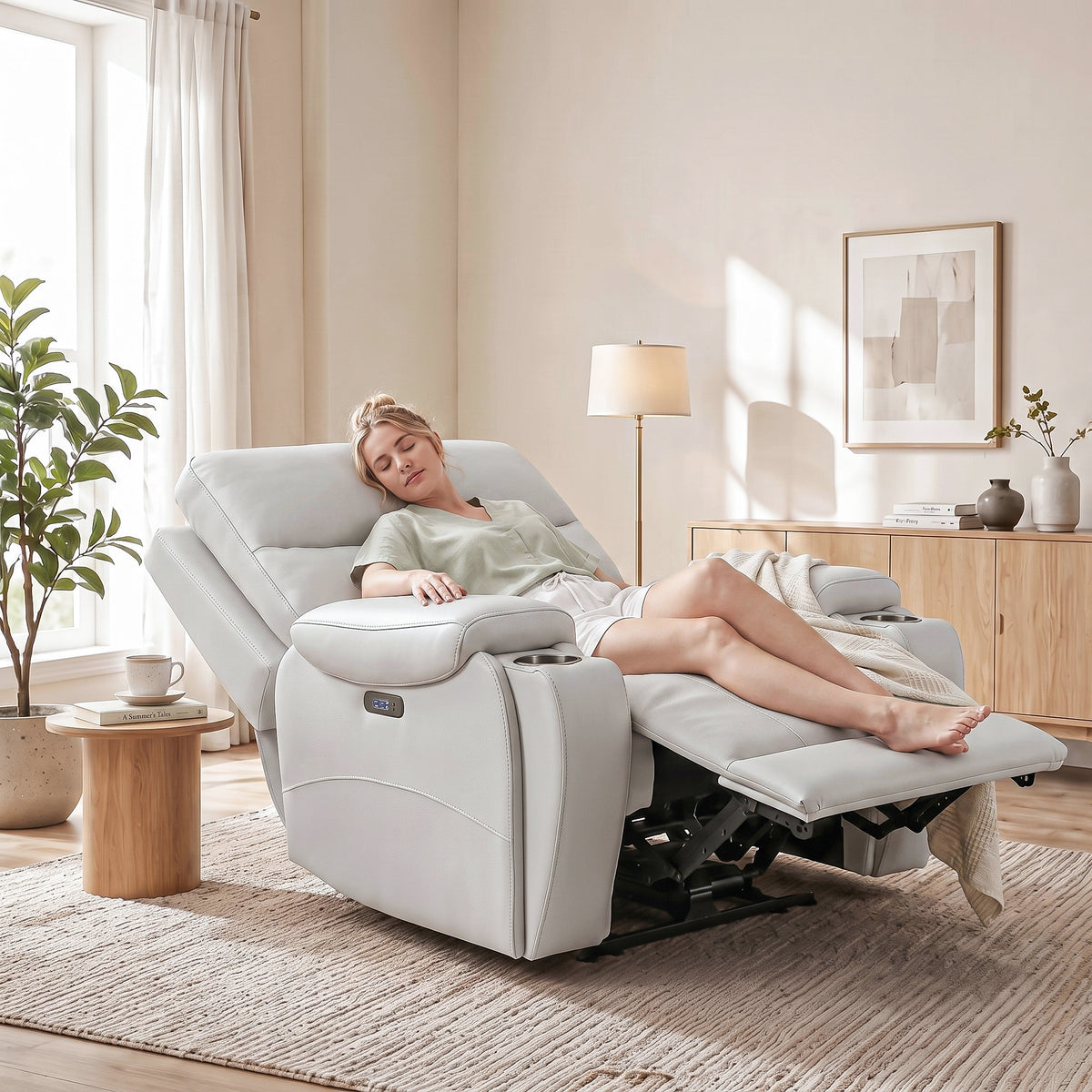 A woman adjusted the white power recliner chair to the optimal position and took a nap.