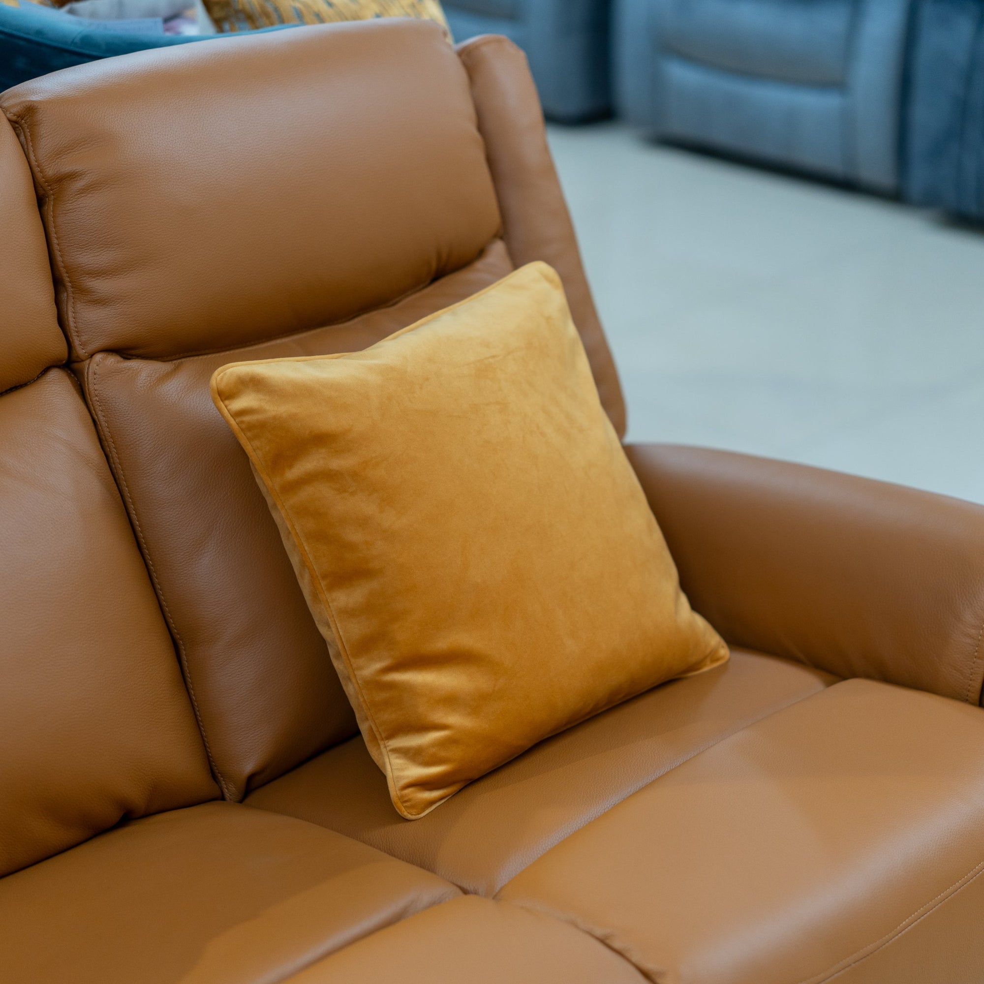 sofa with a butterscotch cushion in a living room setting
