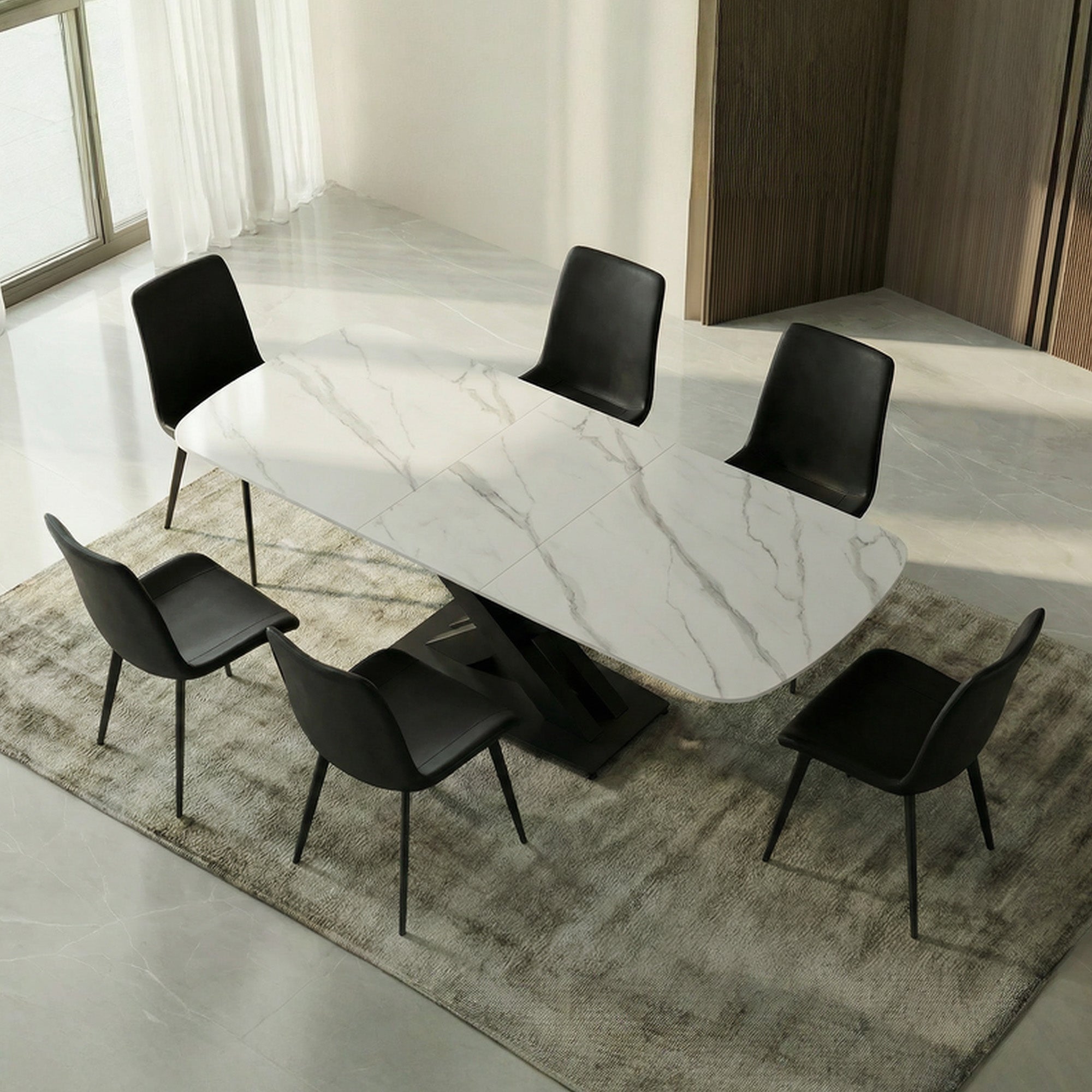 Extendable dining table with sintered stone top