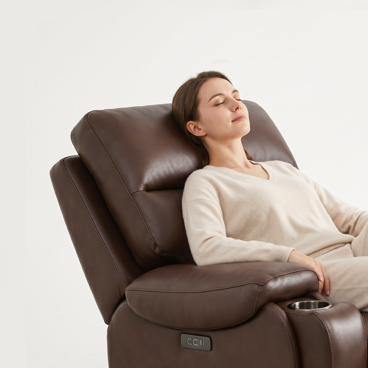 The adjustable power backrest and headrest of the brown power recliner chair make women feel very comfortable.