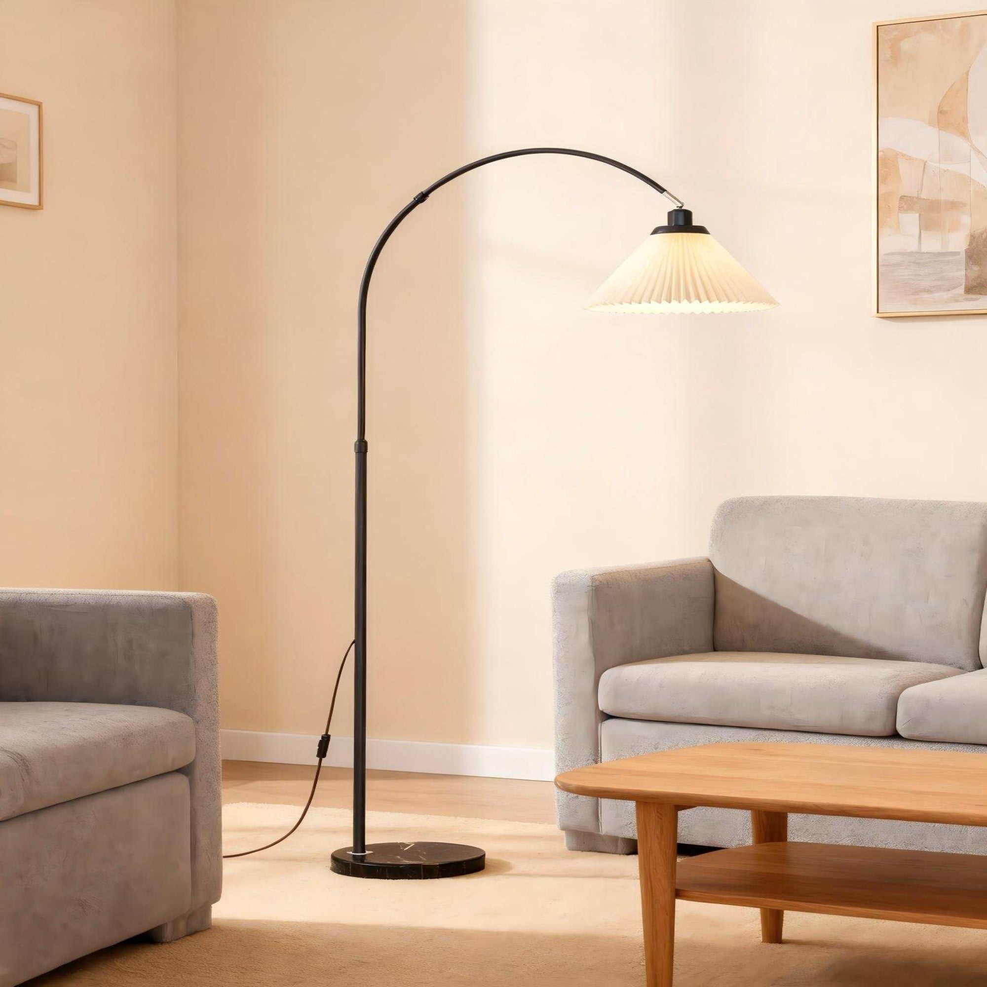 Black Arc Floor Lamp - Modern "fishing lamp" with soft pleated shade, ideal for sofa-side reading in living rooms and bedrooms.